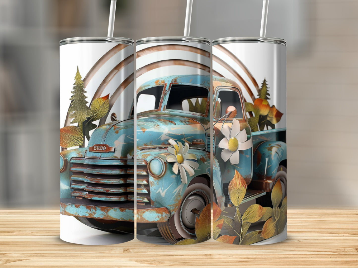 Turquoise vintage pickup truck with autumn leaves and rainbow design on tumblers.
