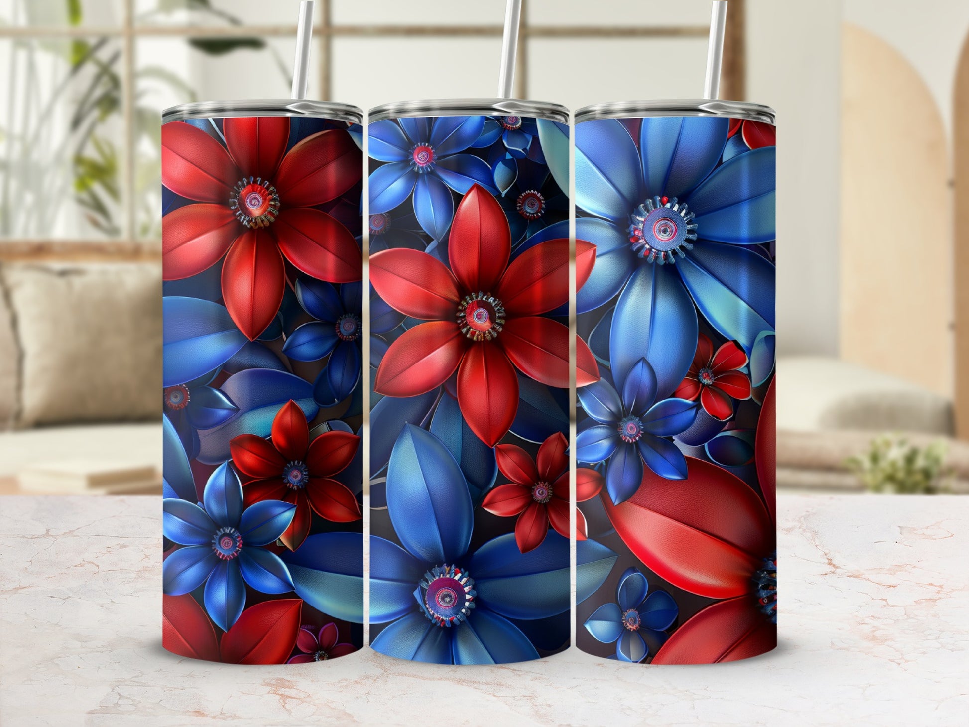 Three tumblers with vibrant red and blue floral designs.