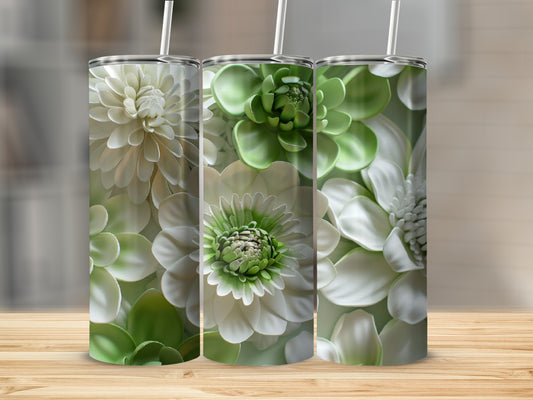 Three white and green floral patterned tumblers on a wooden surface.