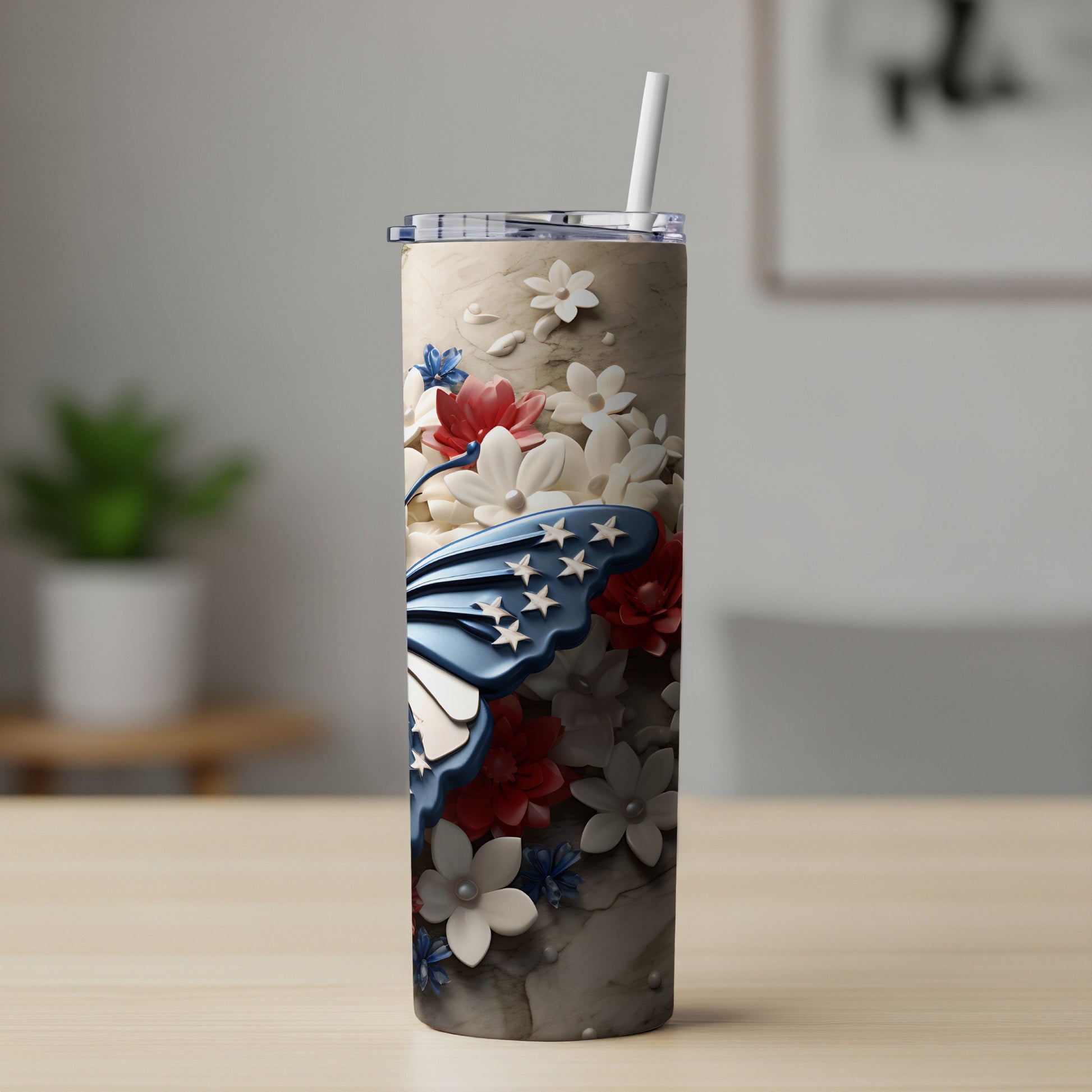 Tall tumbler with butterfly design and floral accents.