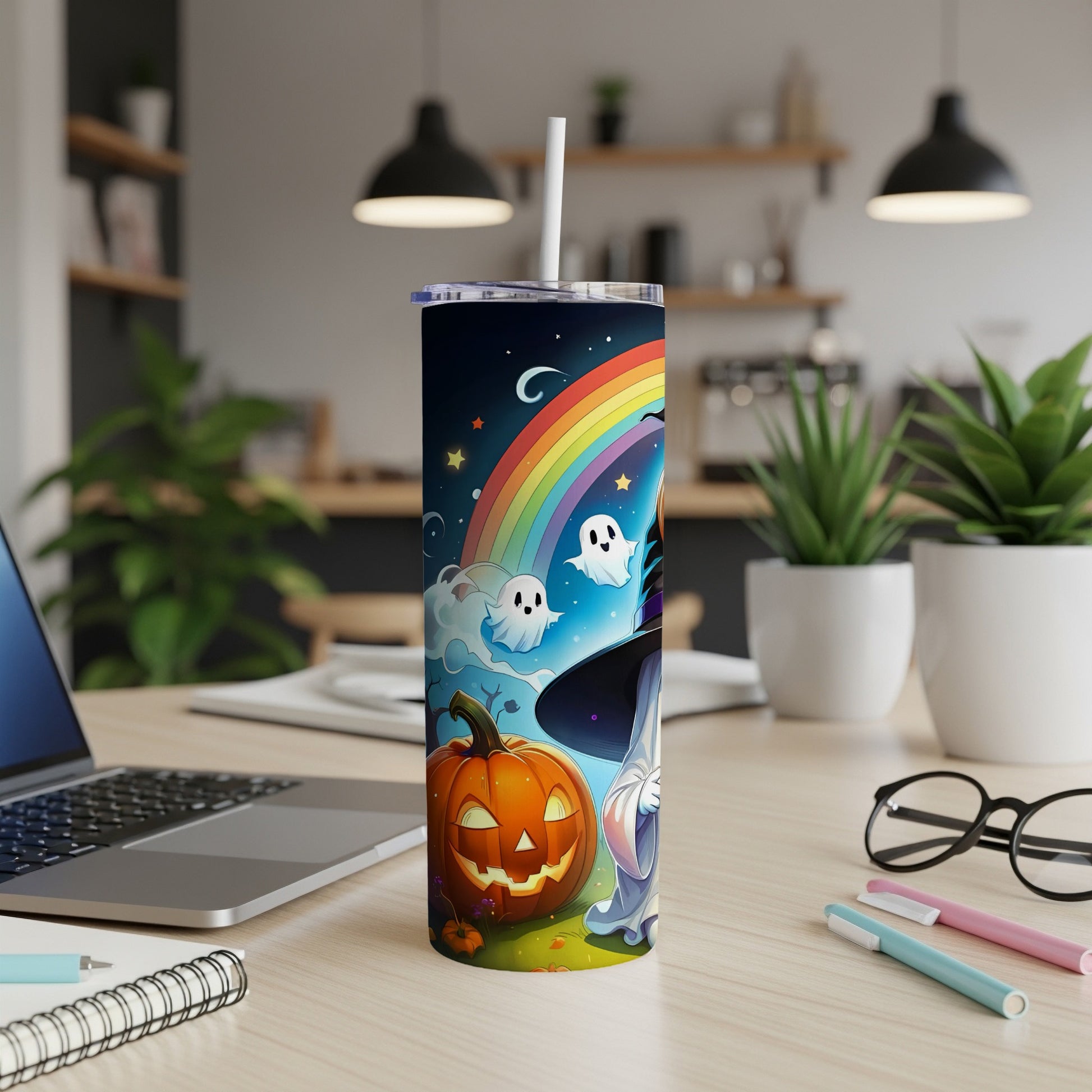 Tumbler with cartoon Halloween design featuring pumpkin, ghosts, and rainbow.