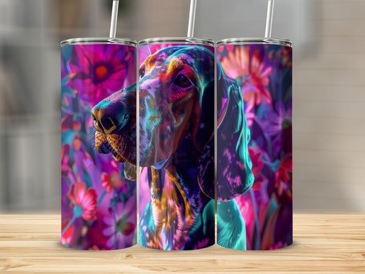 Hound dog portrait with colorful floral background and straw.
