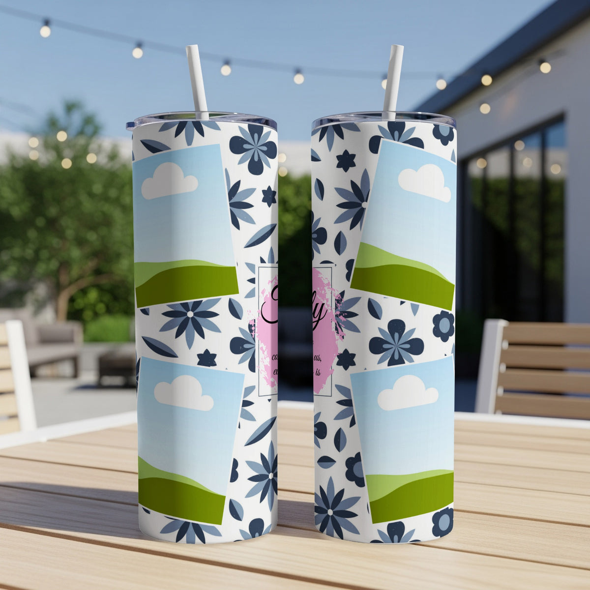 Two tumblers with a floral pattern and placeholder landscape images on a wooden table.