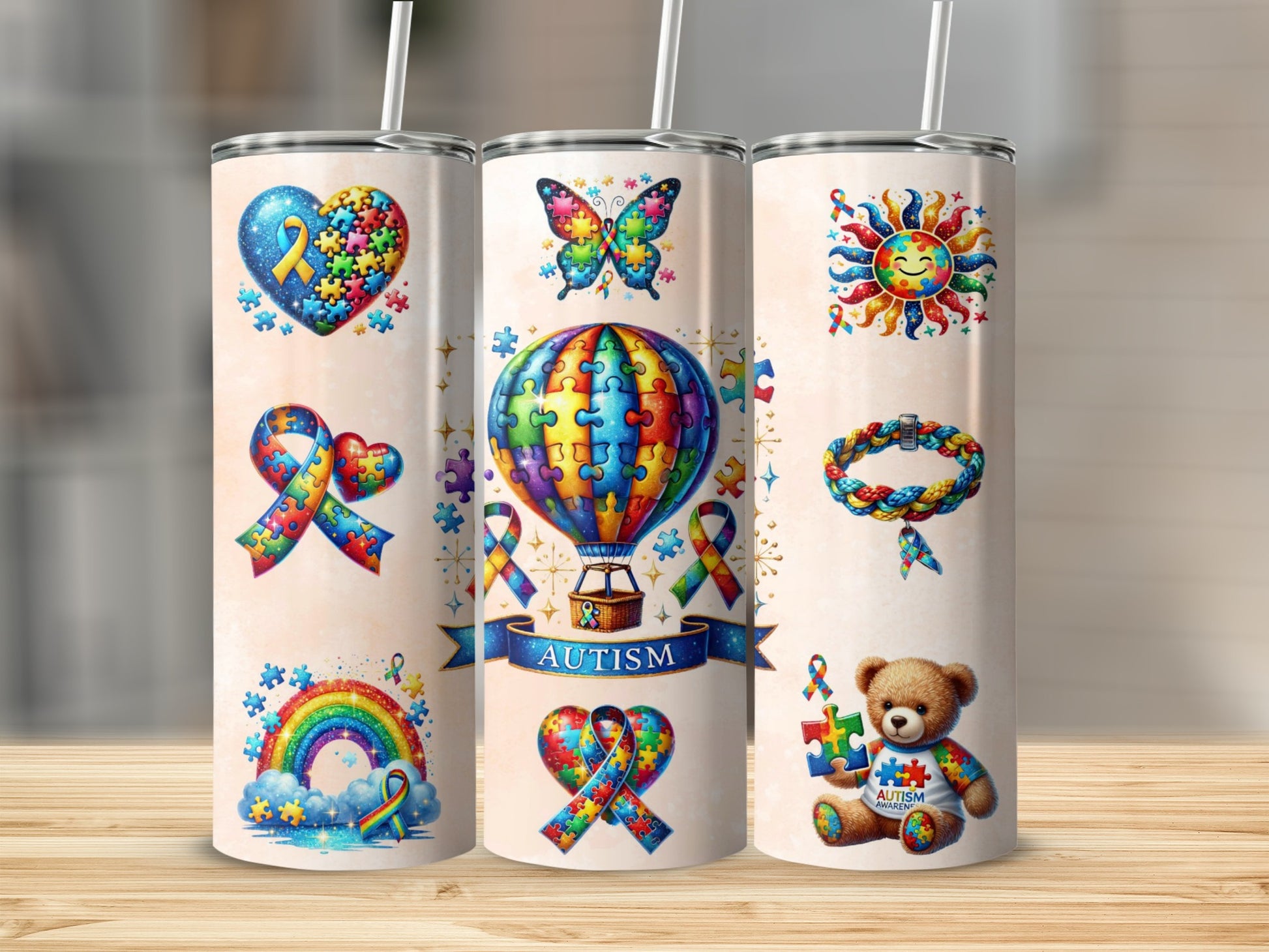 Autism awareness tumbler with puzzles, ribbons, and rainbow designs.
