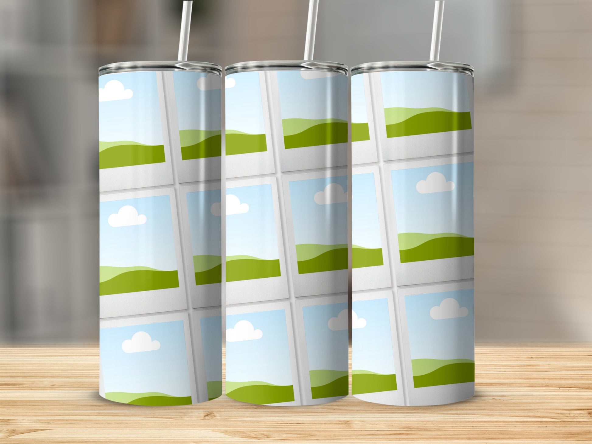 Three tumblers with a grid of landscape photos and straws on a wooden surface.