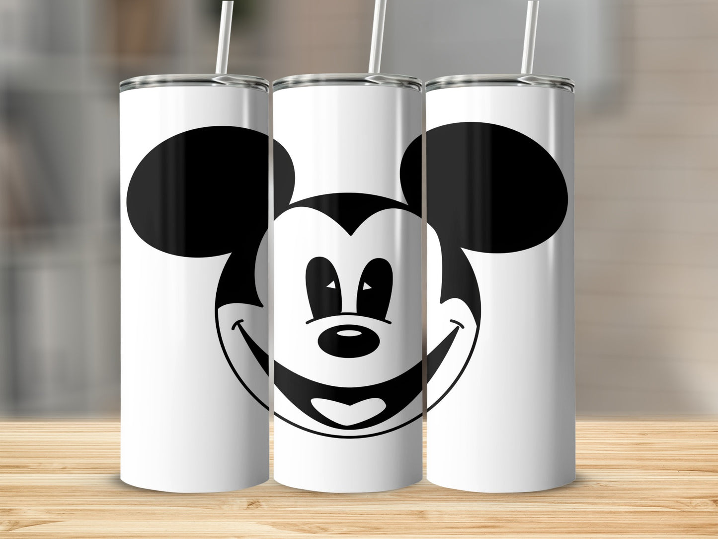 Three white tumblers with Mickey Mouse face graphic.