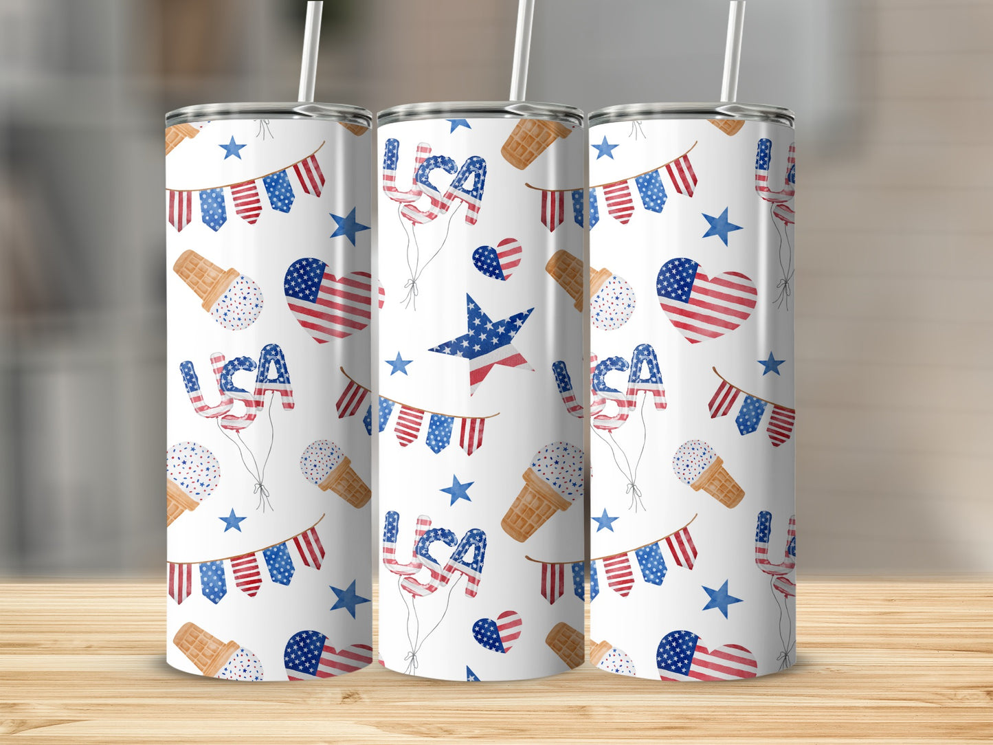 Three tumblers with US flag patterns, ice cream cones, and patriotic bunting decor.