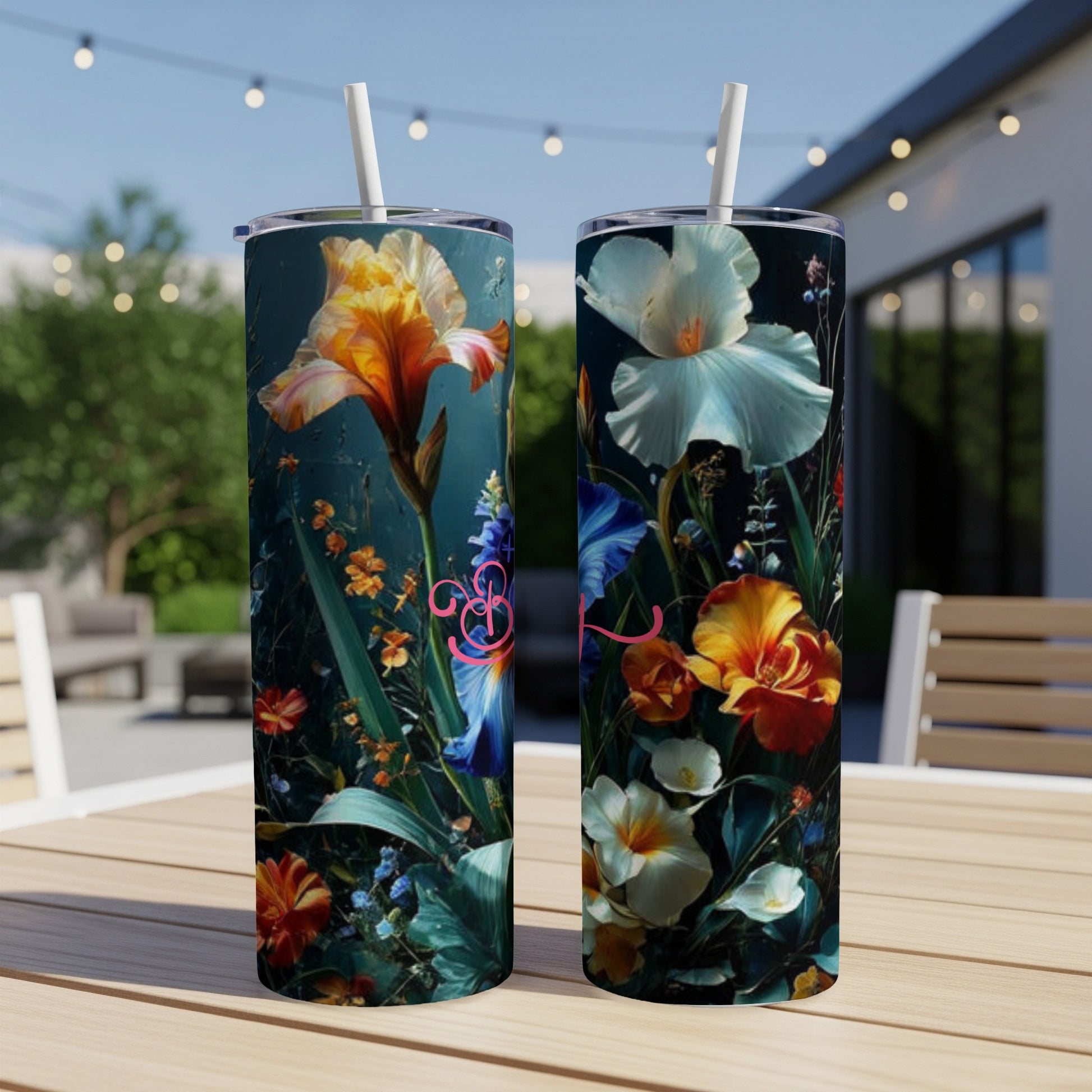 Two tumblers with a vibrant floral design featuring irises and other colorful flowers.