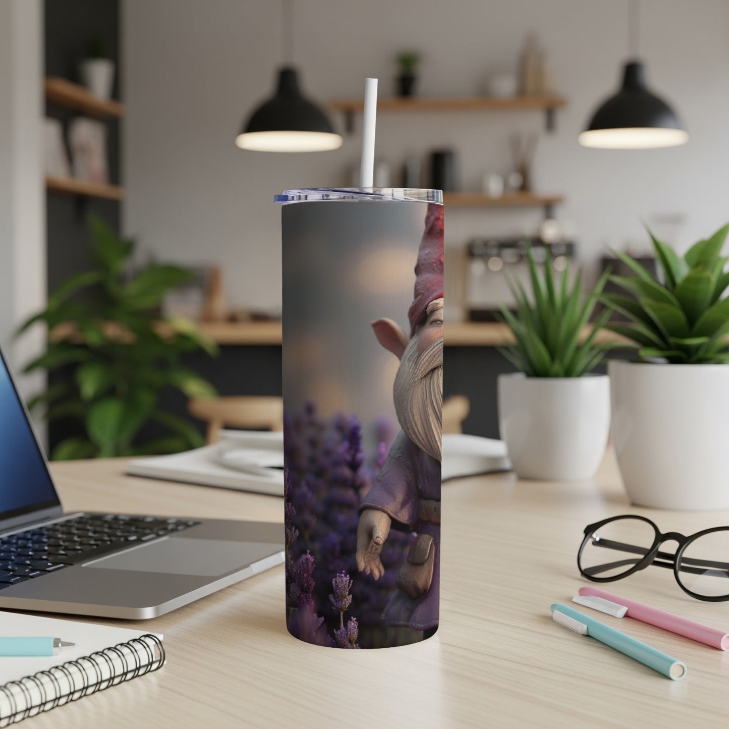 Tall tumbler with gnome and lavender design on desk.