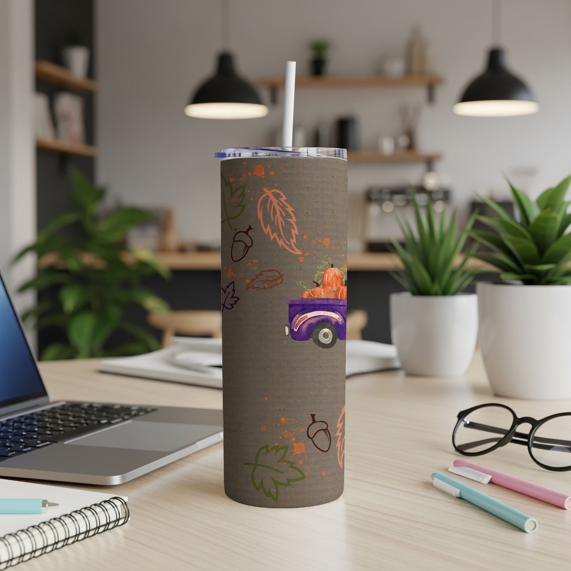 Brown tumbler with a purple truck, pumpkins, and fall leaves pattern.