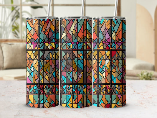 Three stained glass tumblers with colorful geometric patterns and straws.