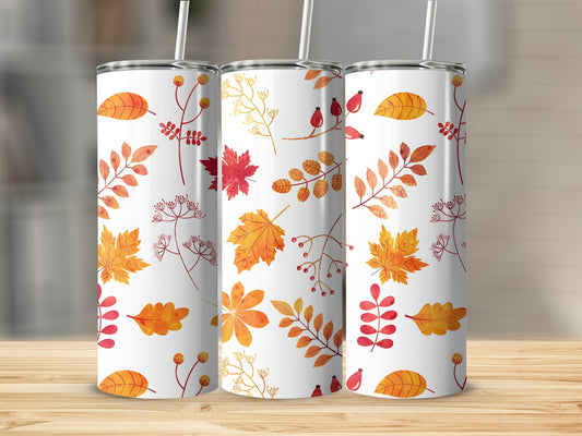 Three white tumblers with a fall leaf pattern.