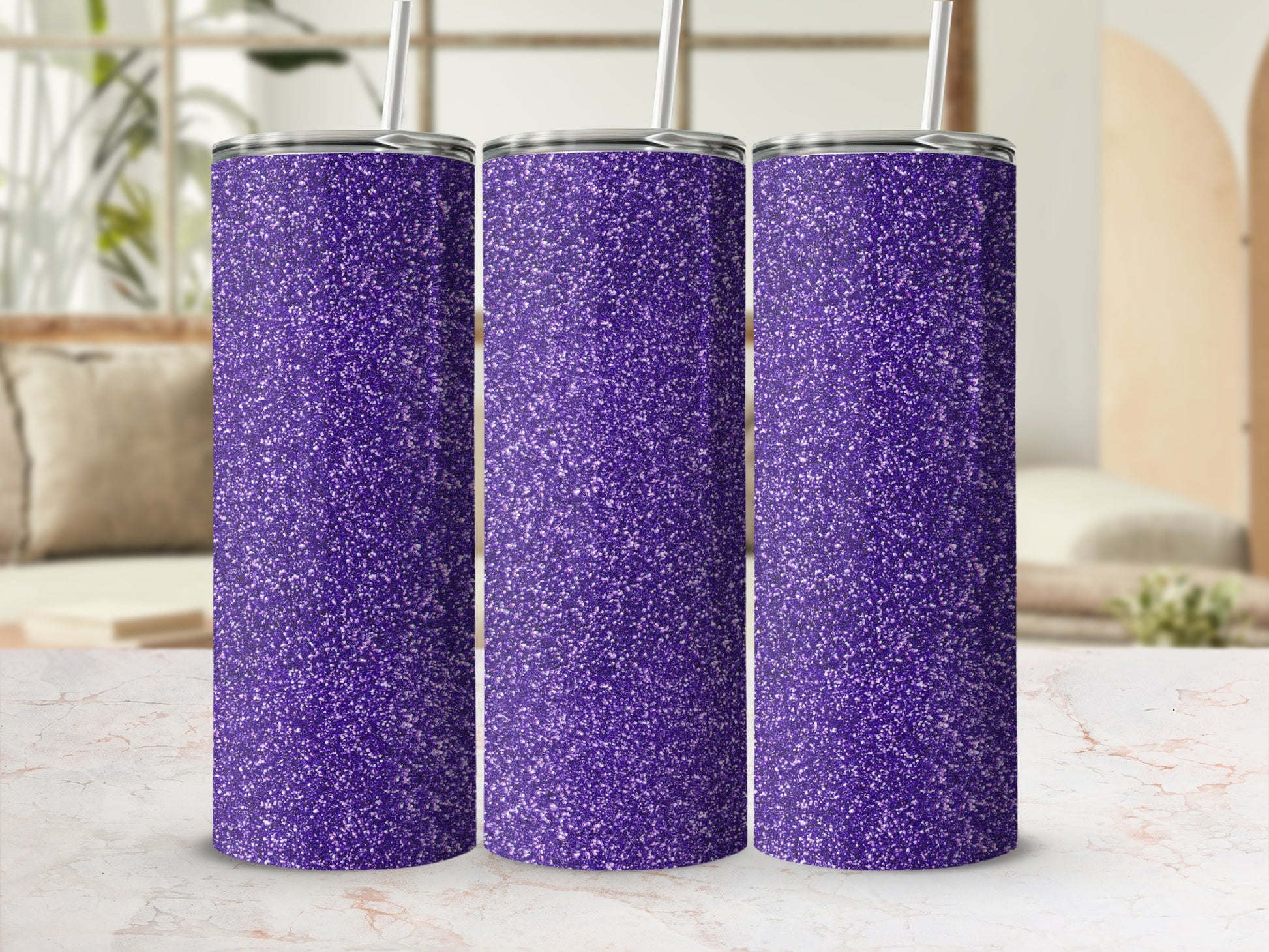 Three purple glitter tumblers with silver lids and straws.