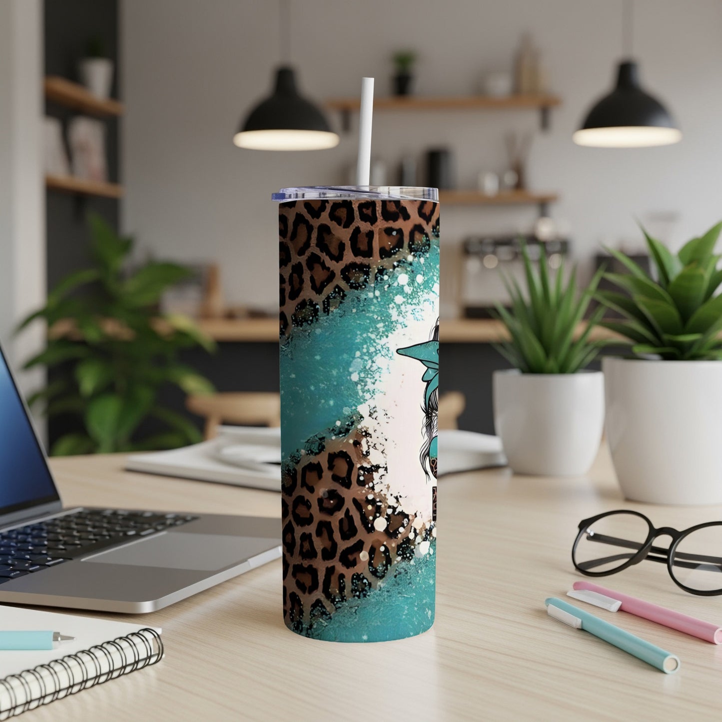 Leopard print and teal splatter tumbler with a sunflower graphic.