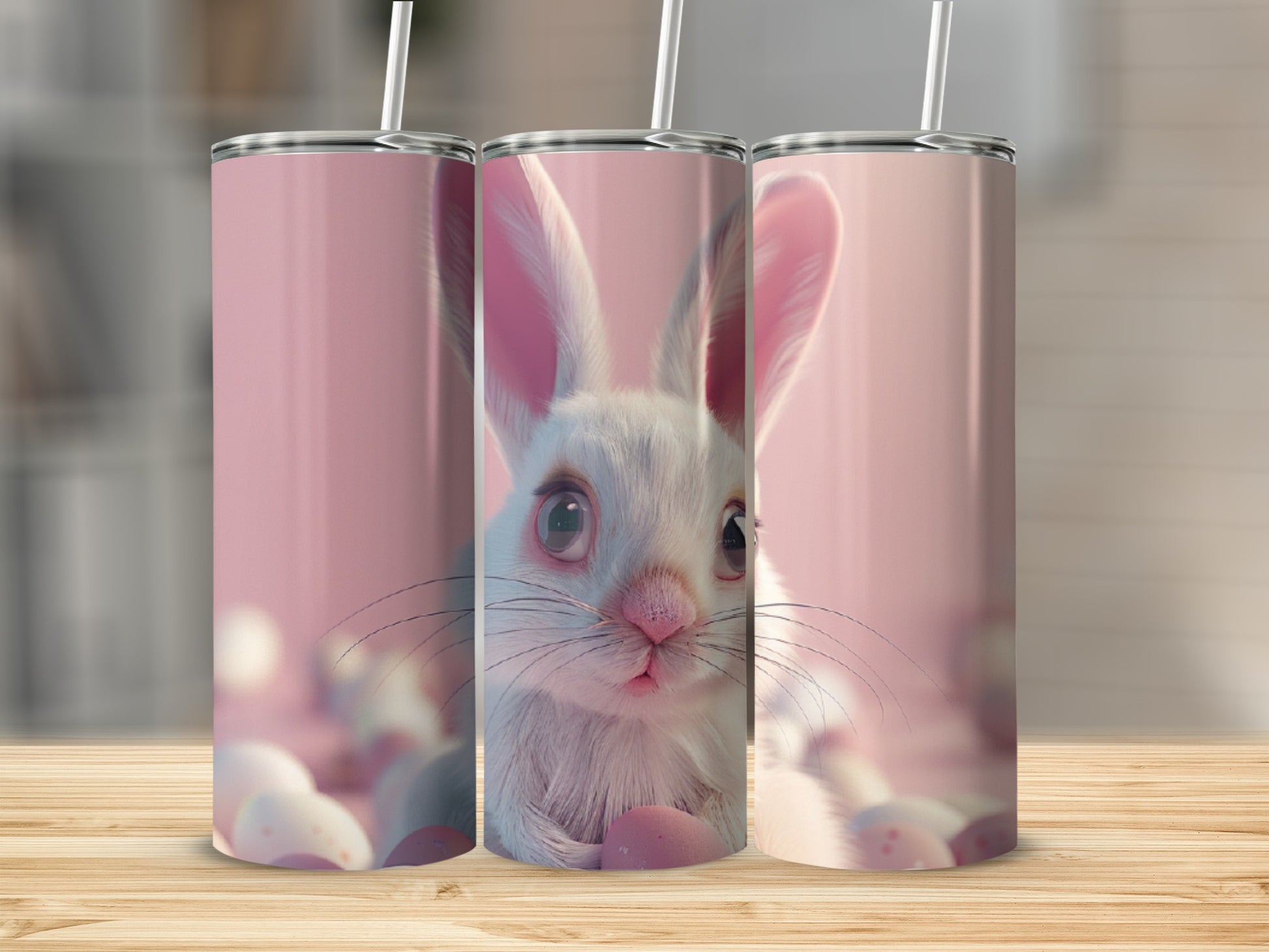 Three tumblers with a close-up of a white bunny's face and pink Easter eggs.