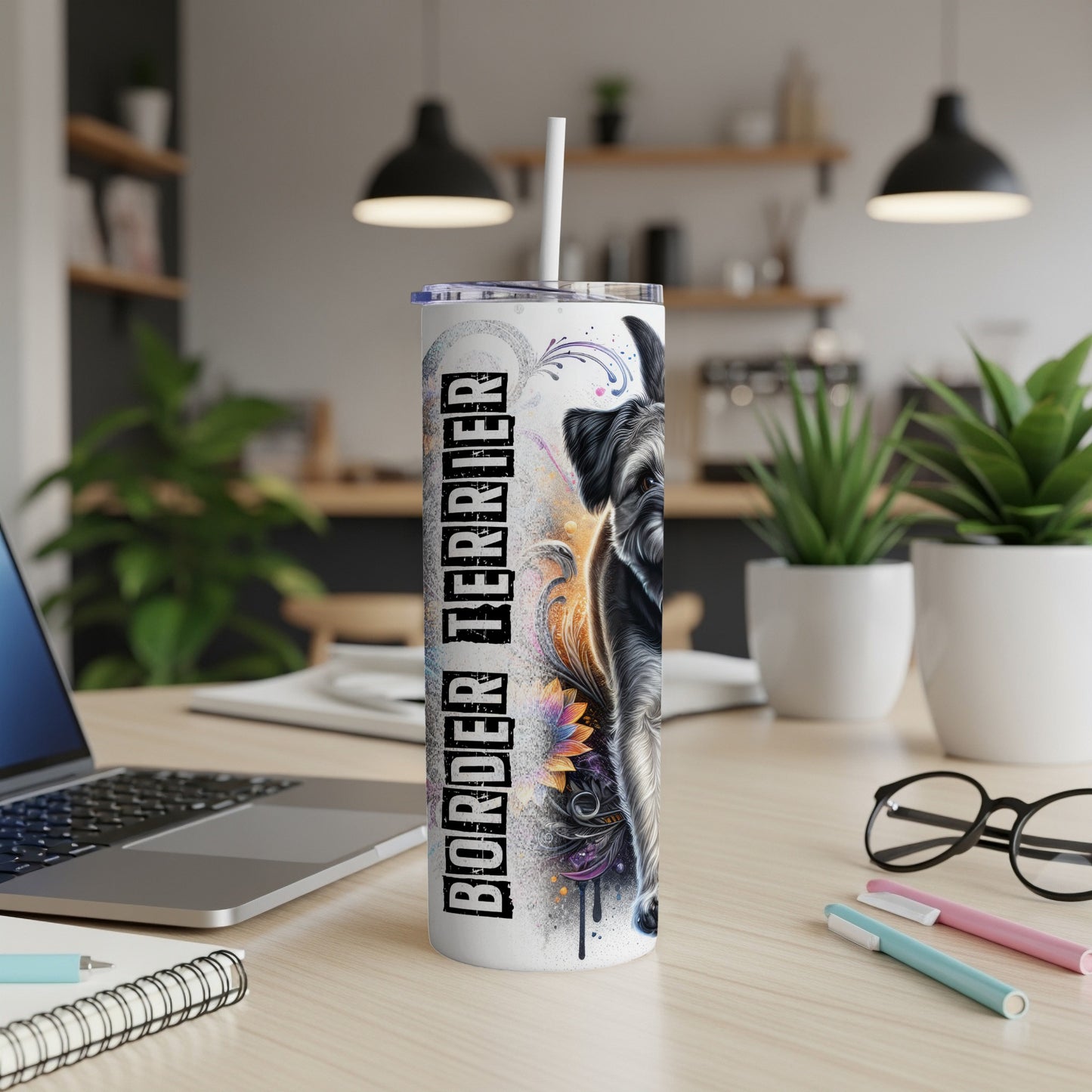 Black dog illustration on a white tumbler with "BORDER TERRIER" text.