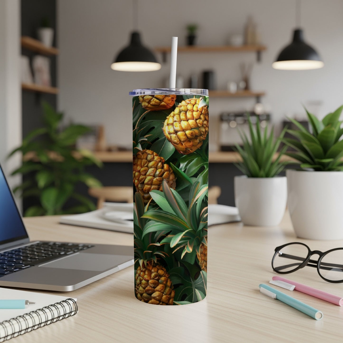 Tumbler with pineapple and tropical leaf pattern.