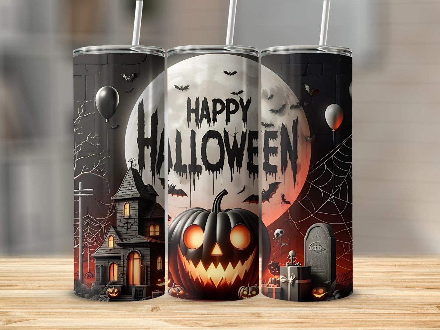 Three tumblers featuring spooky Halloween designs with a haunted house, jack-o'-lantern, and bats.