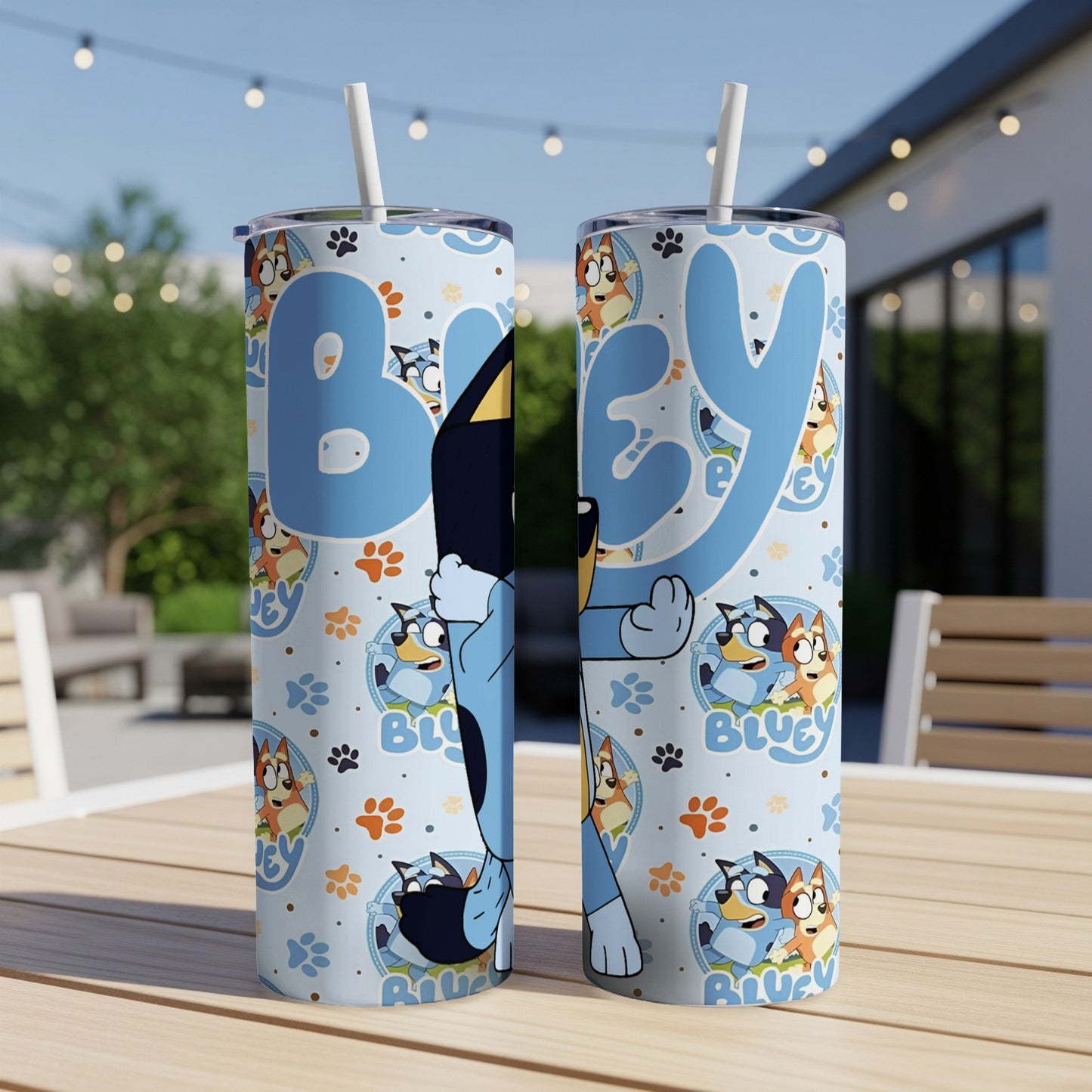 Bluey characters on a light blue tumbler with paw prints and straws.
