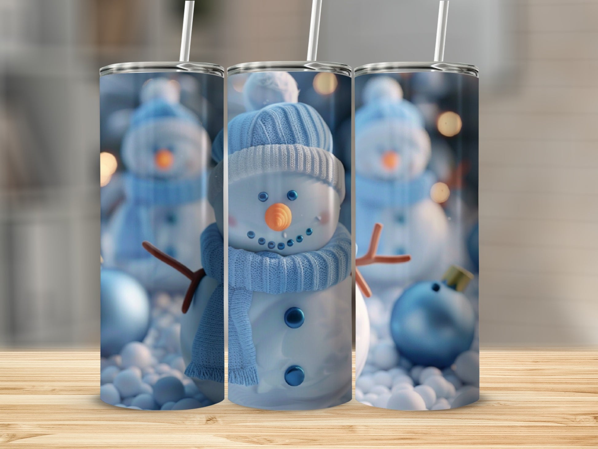 Three tumblers featuring a smiling snowman wearing a blue hat and scarf.
