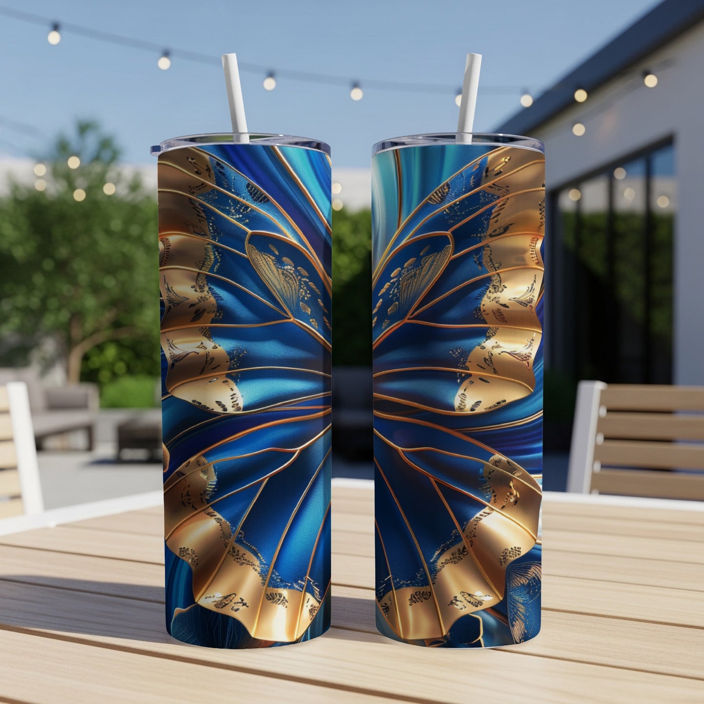 Two tumblers with a blue and gold abstract butterfly wing design.