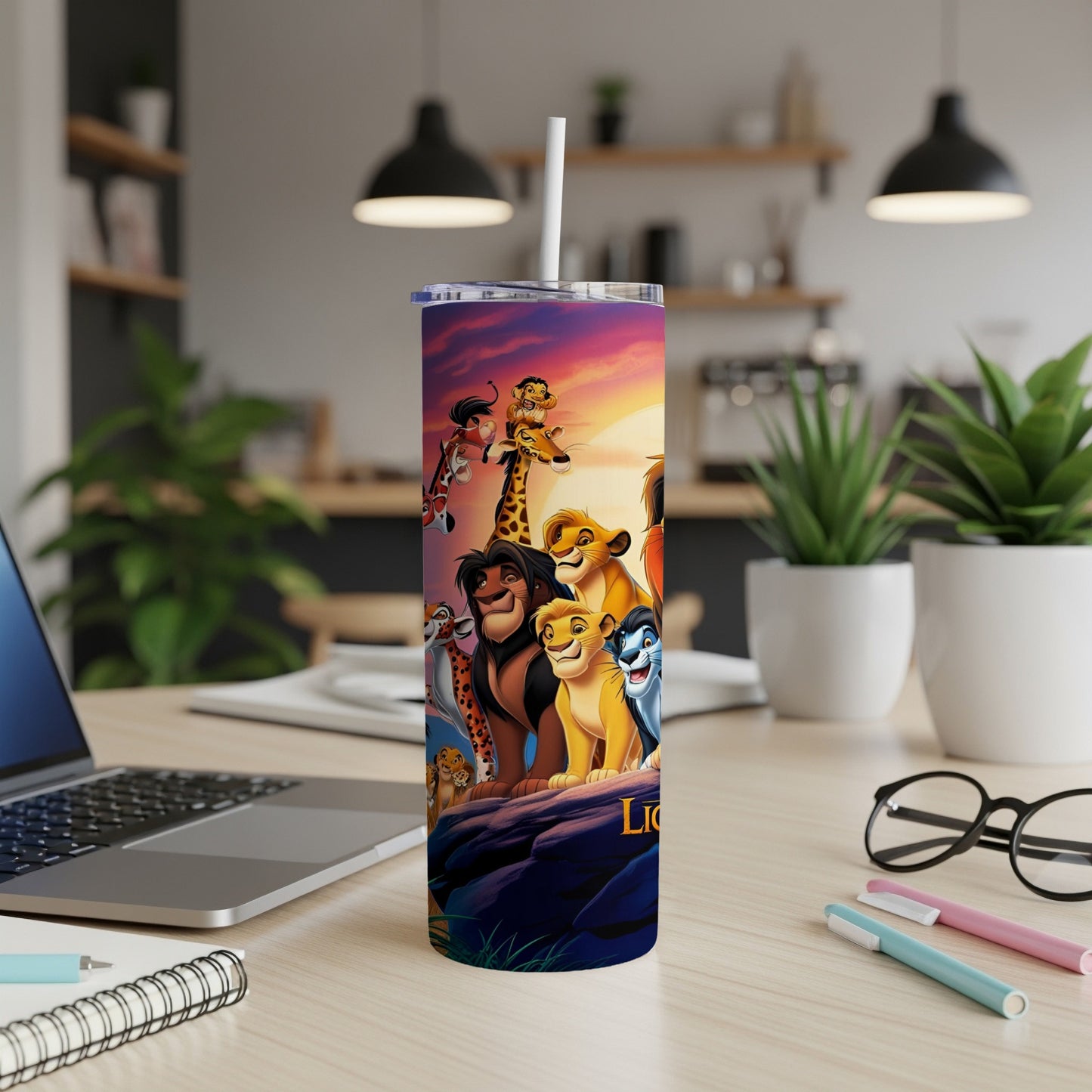The Lion King characters on a purple gradient tumbler with a straw.