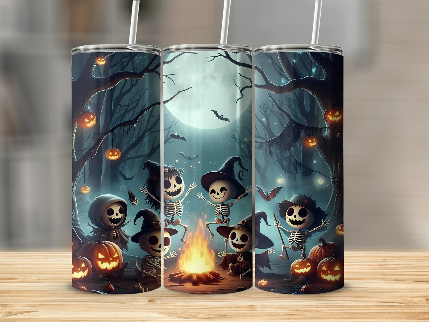 Halloween tumblers with skeletons, pumpkins, bats, and a campfire under a full moon.