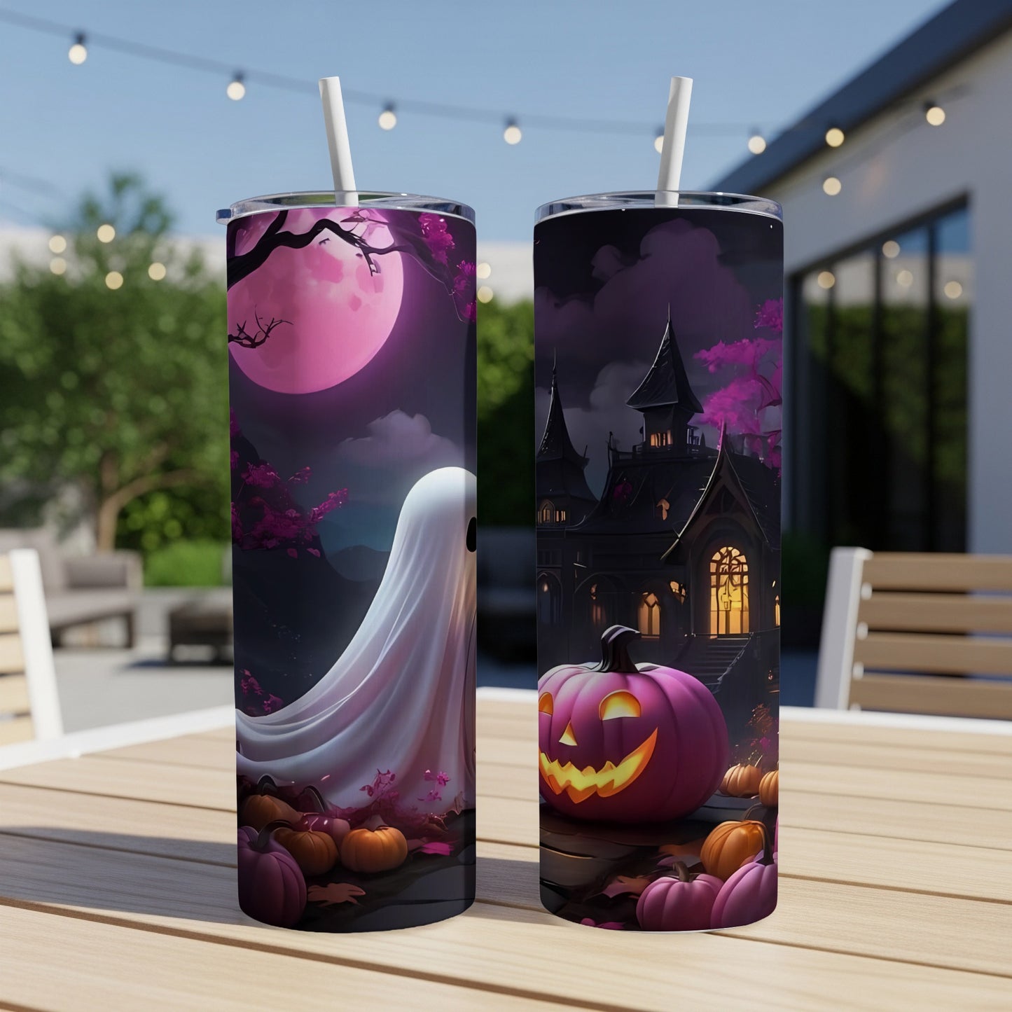 Two Halloween tumblers with spooky ghost and haunted house designs.