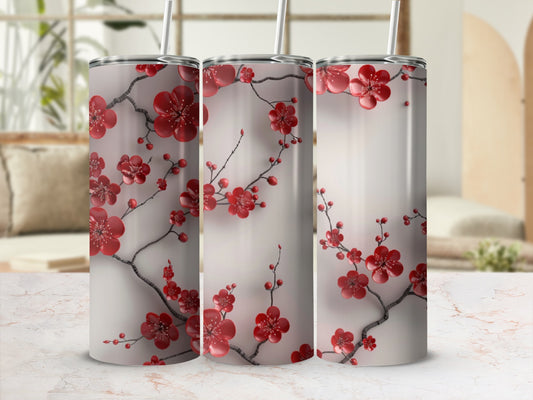 Triptych of tumblers with red cherry blossoms and grey branches on a cream background.