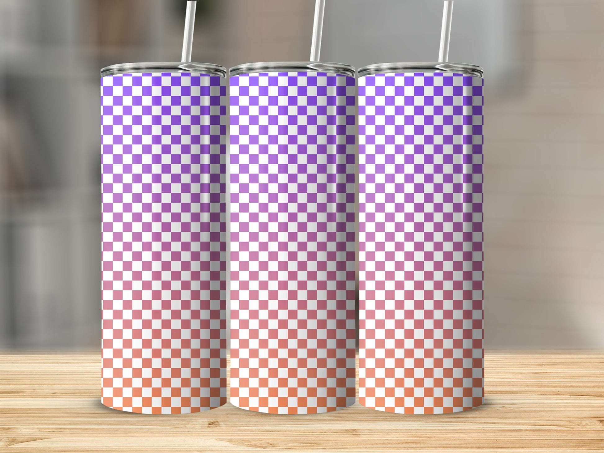 Three tall tumblers with a purple and orange checkered gradient pattern.