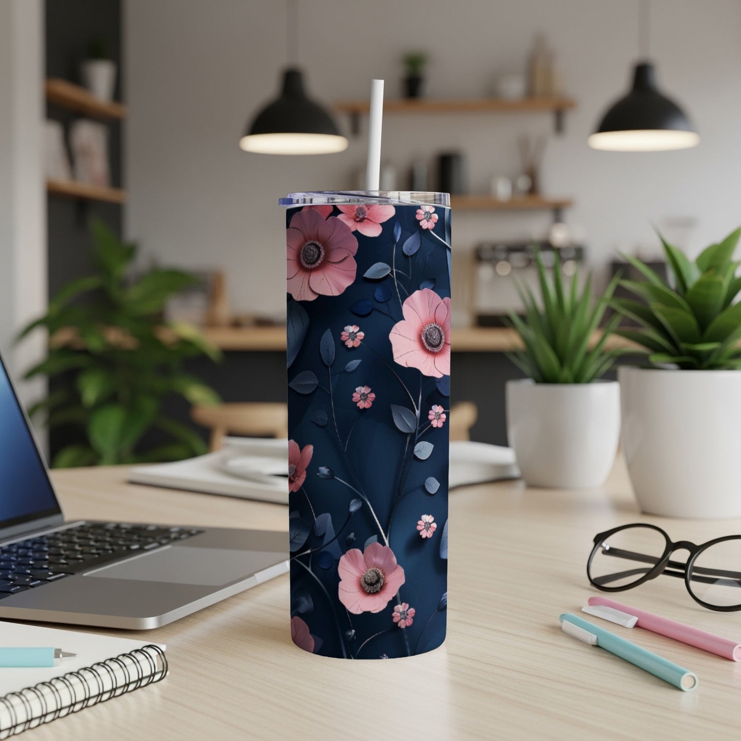 Dark navy tumbler with pink floral pattern and white straw.