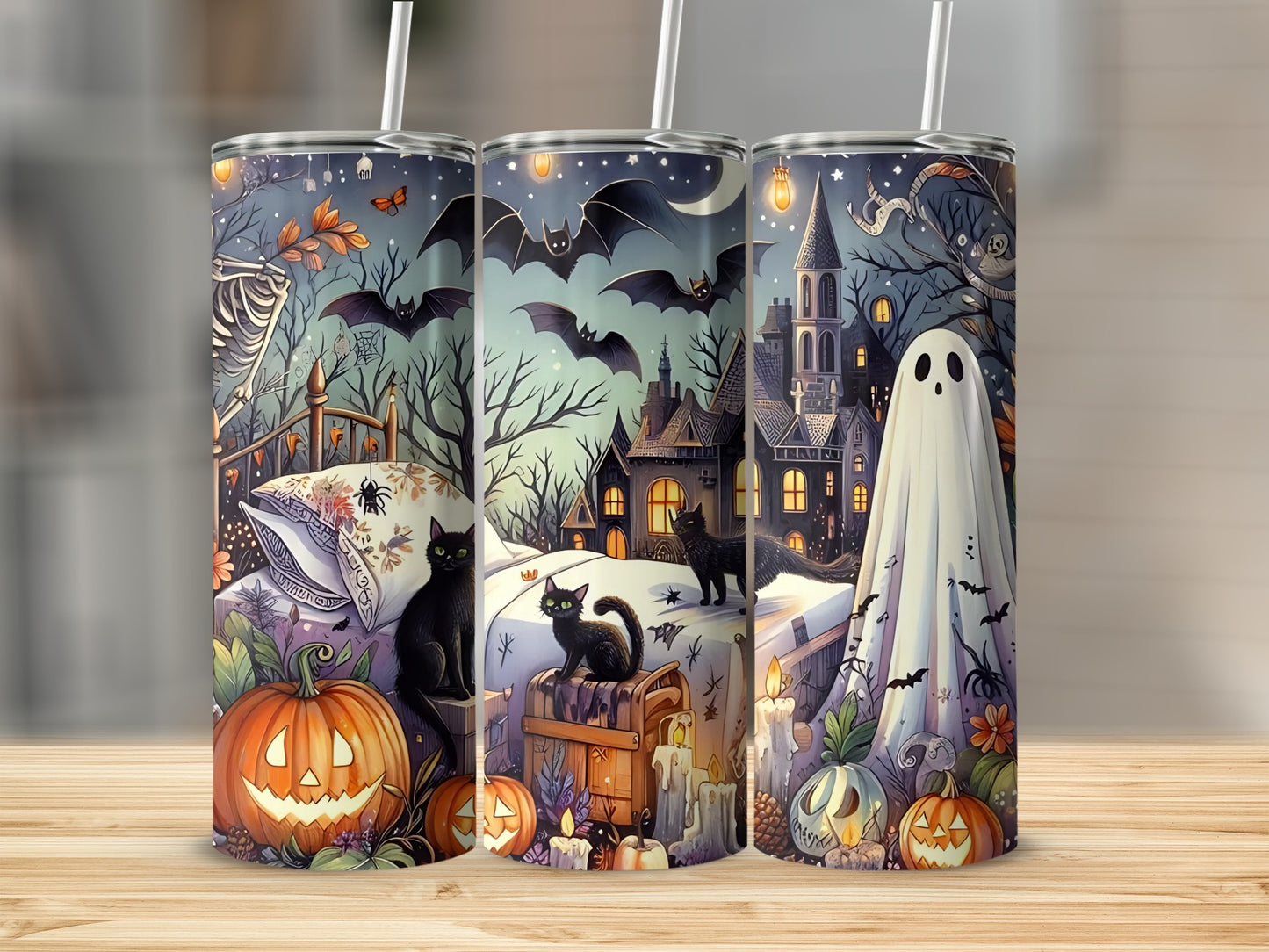 Three tumblers display a Halloween scene with ghosts, cats, pumpkins, bats, and a castle.