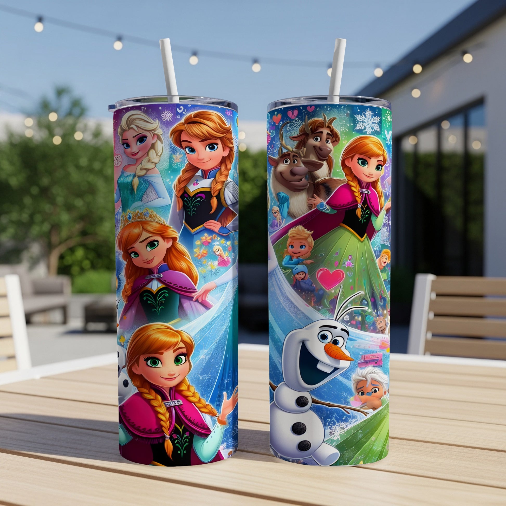 Two Disney Frozen themed tumblers with Elsa, Anna, Olaf, and Sven on a wooden table.