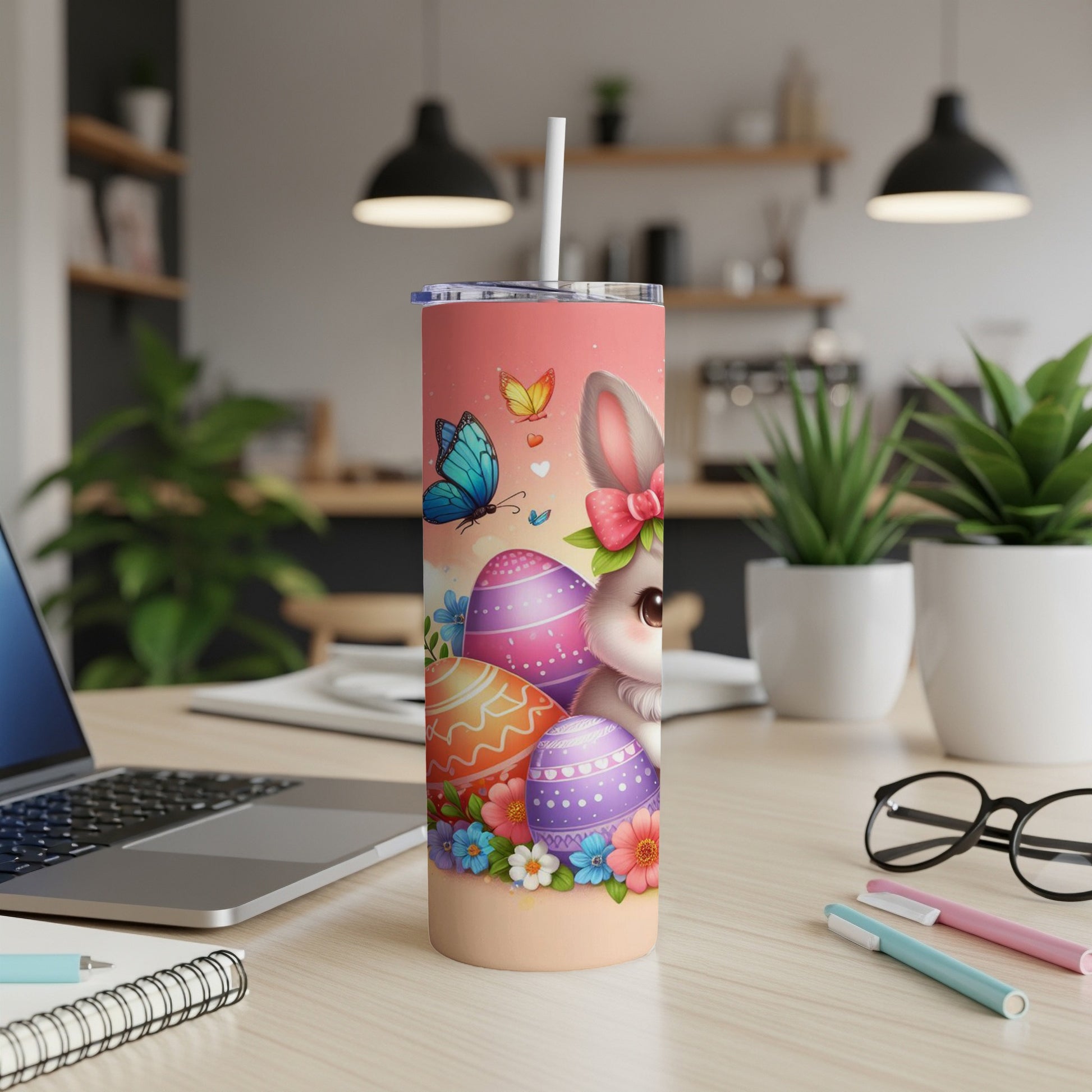Easter bunny with colorful eggs and butterflies on a pink tumbler.