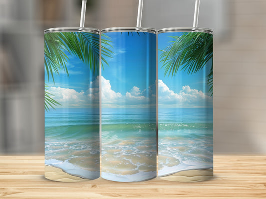 Three tumblers with beach scene design and palm fronds.