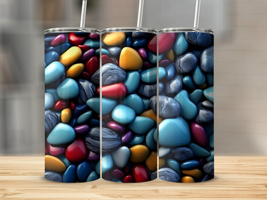 Three tumblers with colorful, glossy pebbles design.