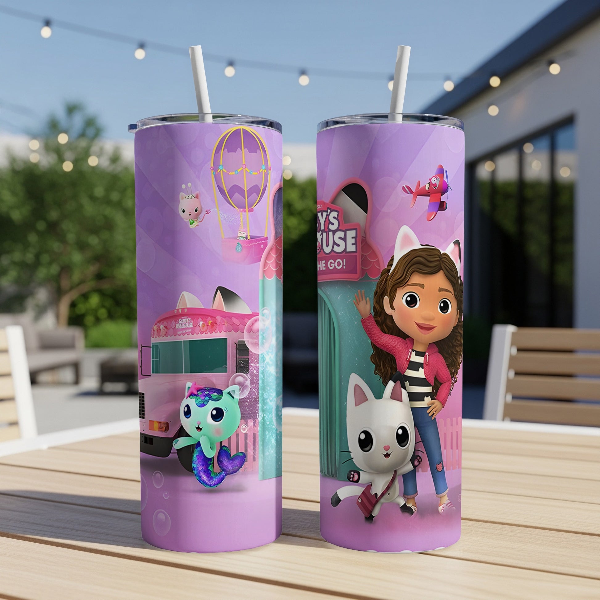 Gabby's Dollhouse characters and text on two purple tumblers.