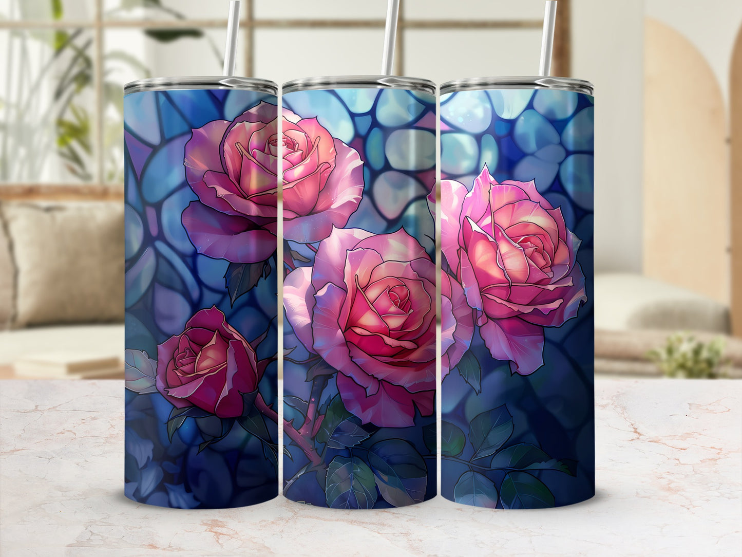 Three tumblers with a floral design of pink roses against a dark blue background.