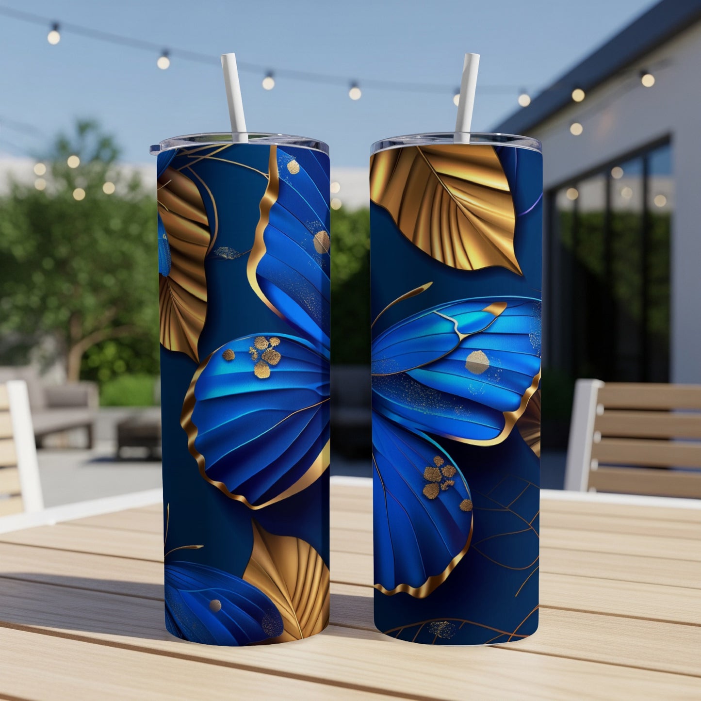 Two blue and gold metallic butterflies on a dark blue patterned tumbler.