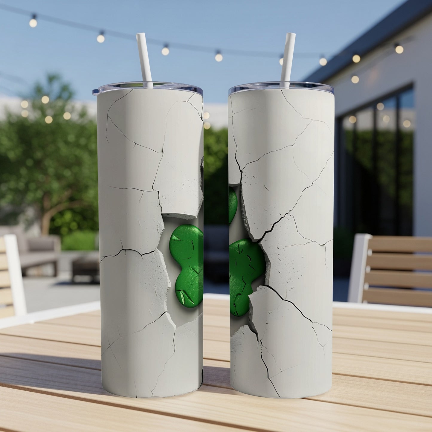 Two white tumblers with cracked concrete design and green shamrocks.