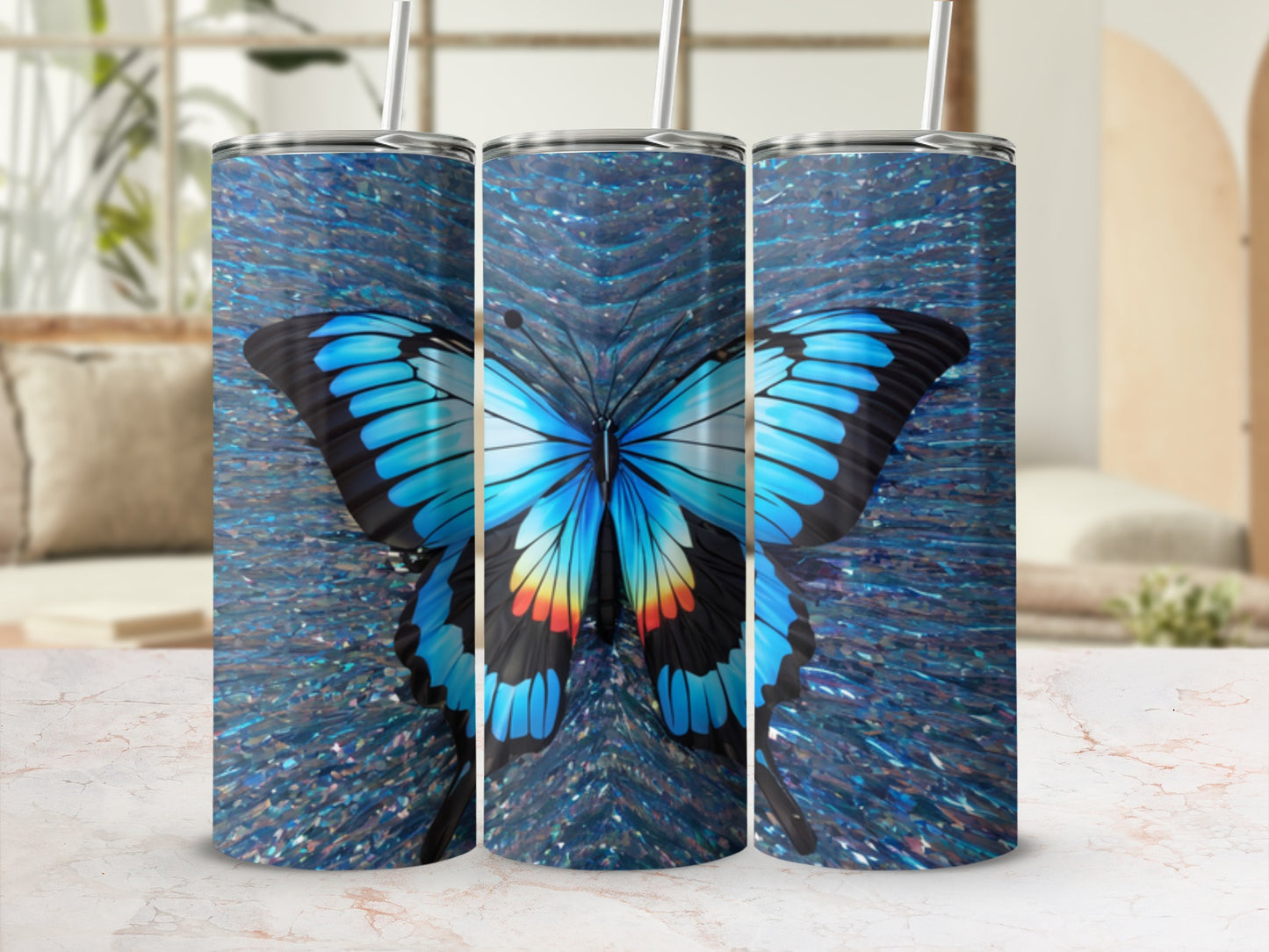 Three tumblers with a blue butterfly and sparkling background.