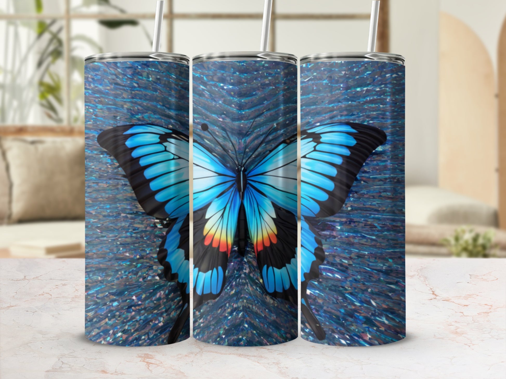 Three tumblers with a blue butterfly and sparkling background.