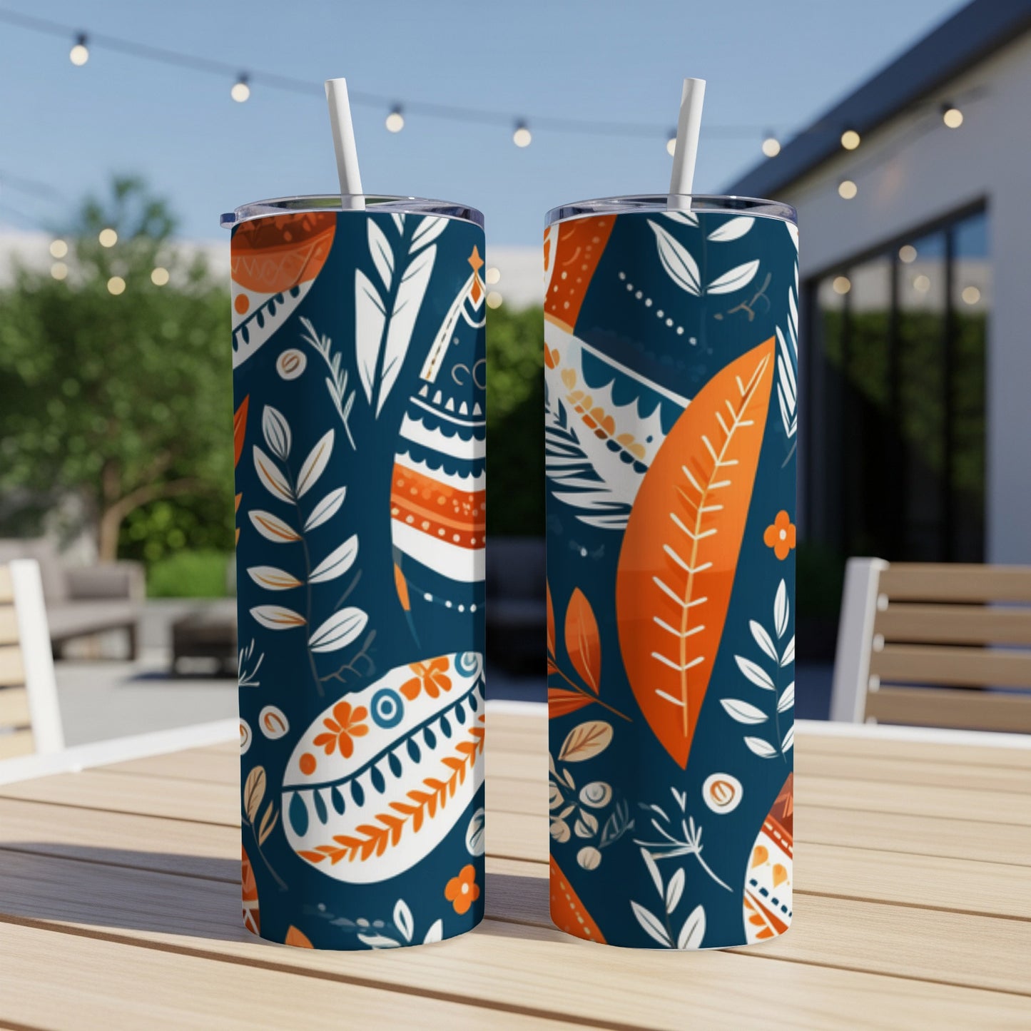 Two navy blue tumblers with abstract floral and feather patterns.
