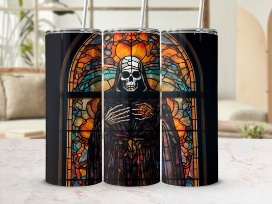 Stained glass tumbler featuring a skeletal figure in robes with a glowing orb.