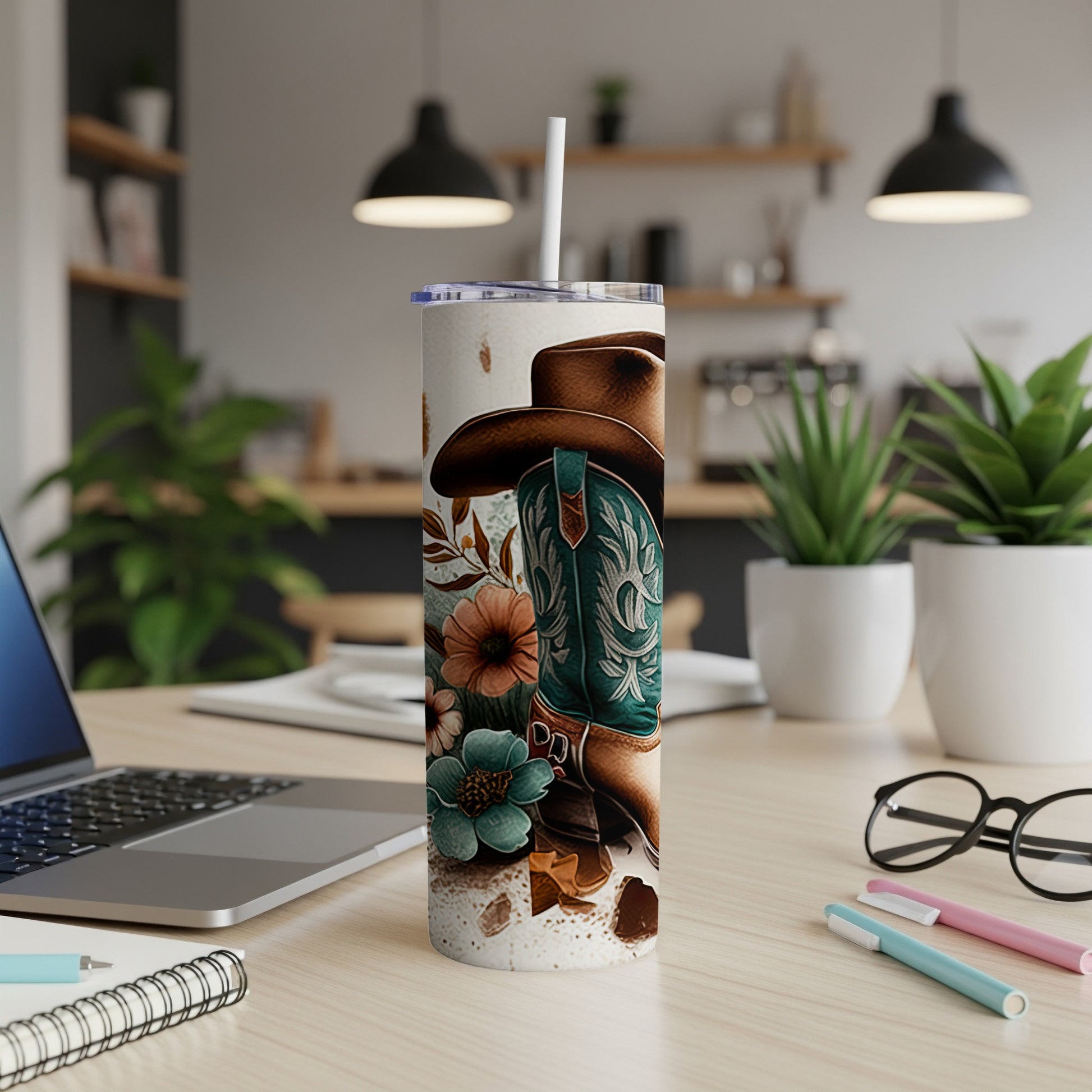 Cowboy boot and hat with floral accents on a tumbler.