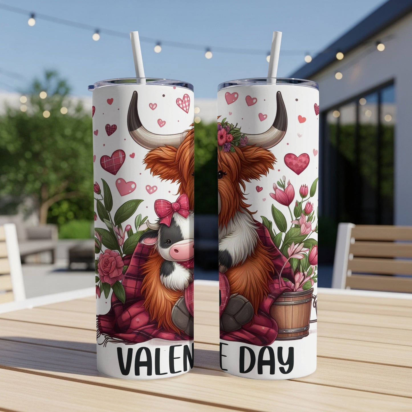 Two tumblers featuring a Highland cow with hearts and flowers for Valentine's Day.