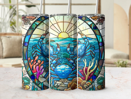 Stained glass tumbler with blue crabs, coral, and ocean sunset design.