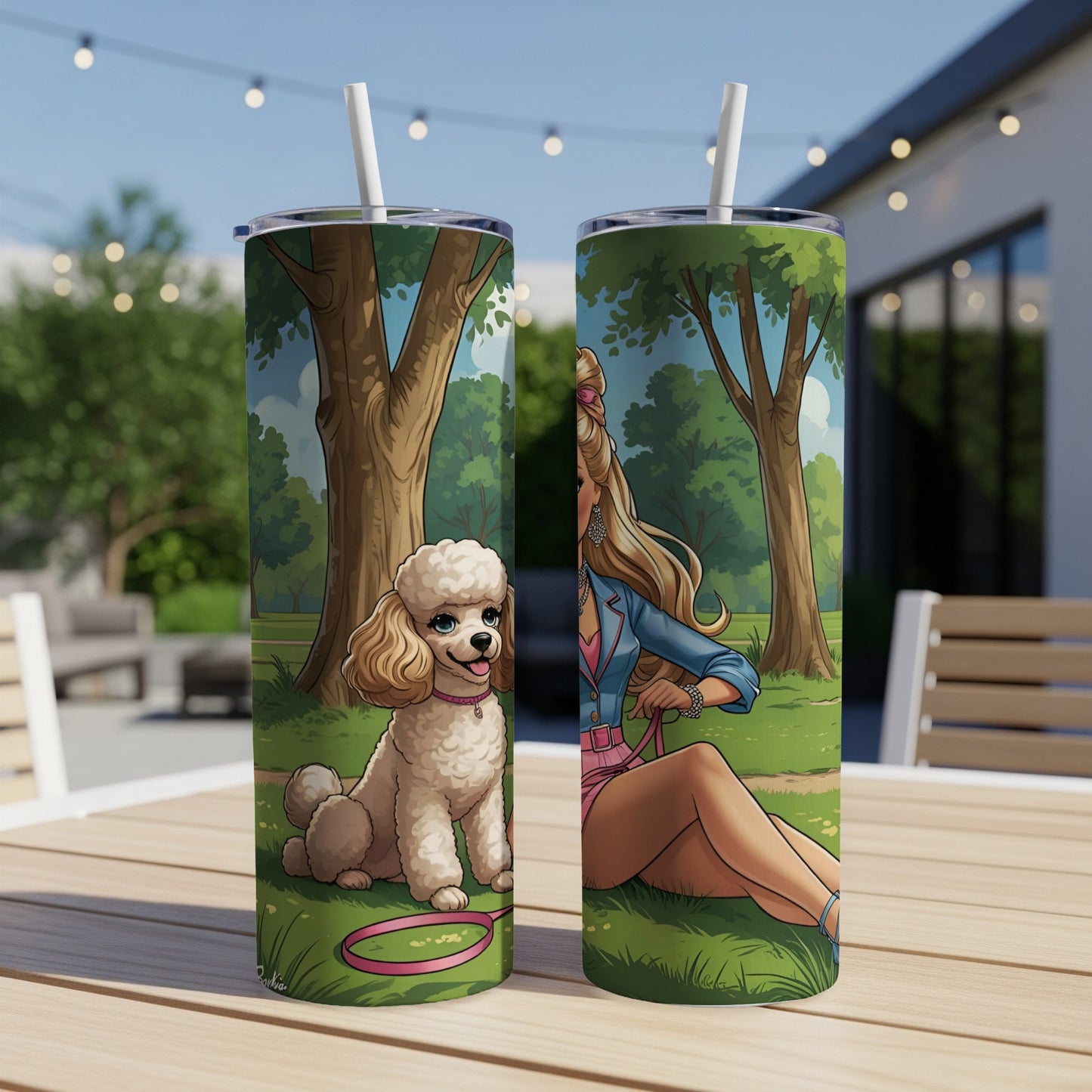 Barbie doll with poodle sitting on grass, outdoors, with two tumblers.