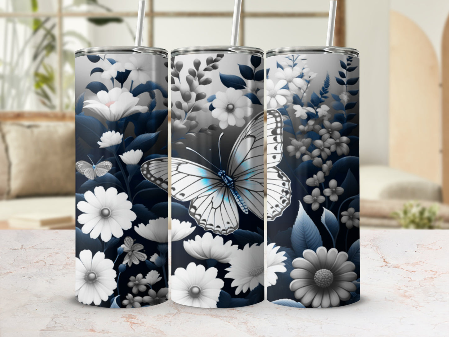 White butterfly and blue flowers on a blue and white floral tumbler.