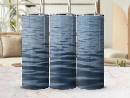 Three tumblers with a close-up view of rippling blue water.